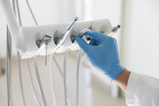 Professional Root Canal Treatment technician working in Alma, MI